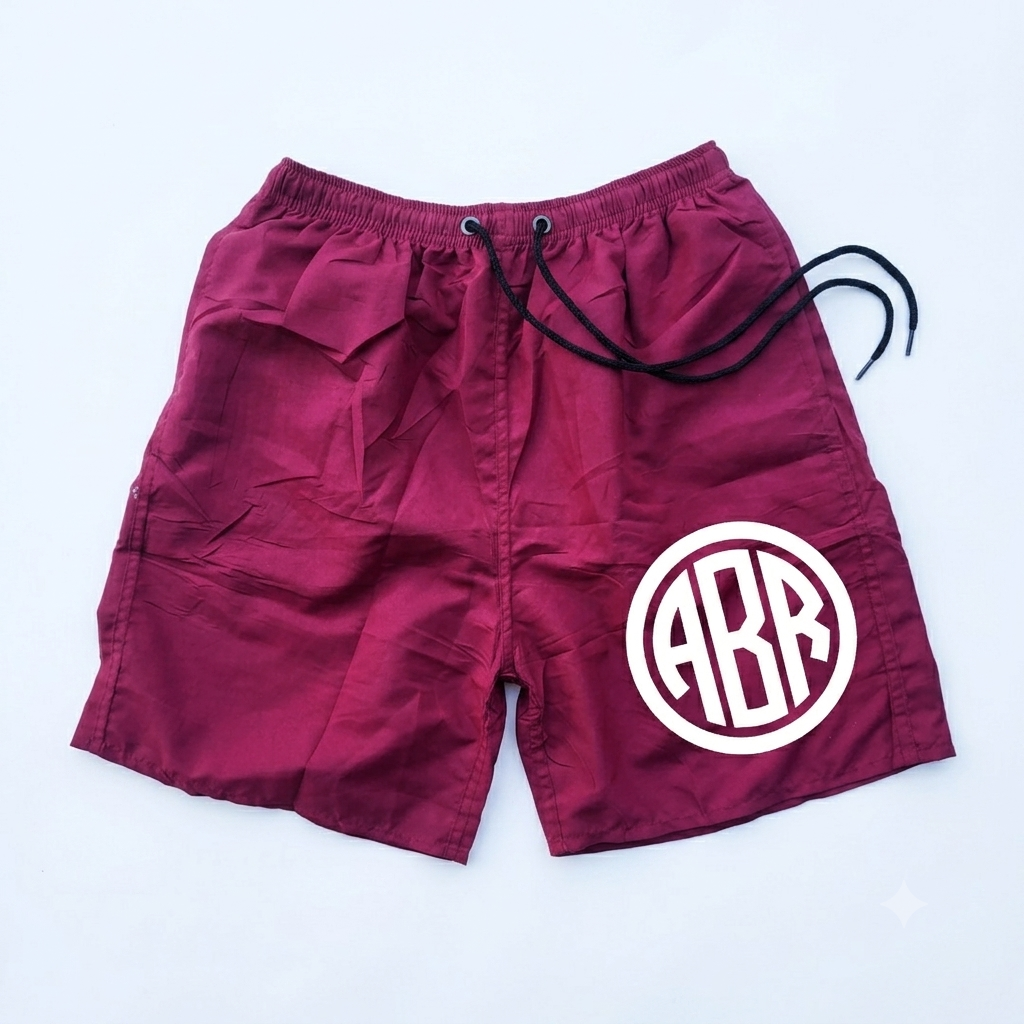 Maroon swim shorts from ABR Store, featuring a comfortable fit and stylish design perfect for beach or poolside wear.